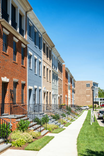 Sideview of two 3-storey apartment buildings.